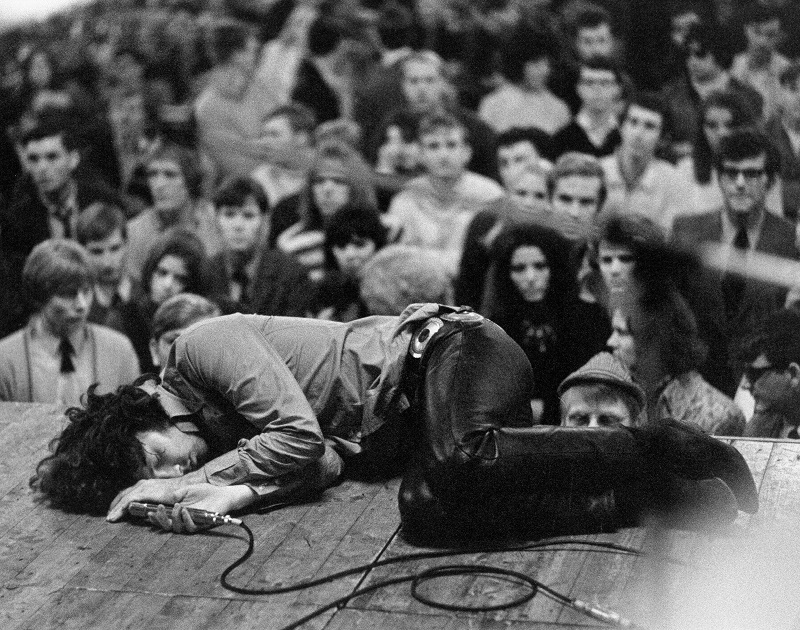 Top 28 Interesting Moments in Rock Music History 3 Jim Morrison laying on the stage during a 1968 concert for The Doors.