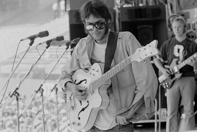 Top 28 Interesting Moments in Rock Music History 7 Neil Young Playing Guitar