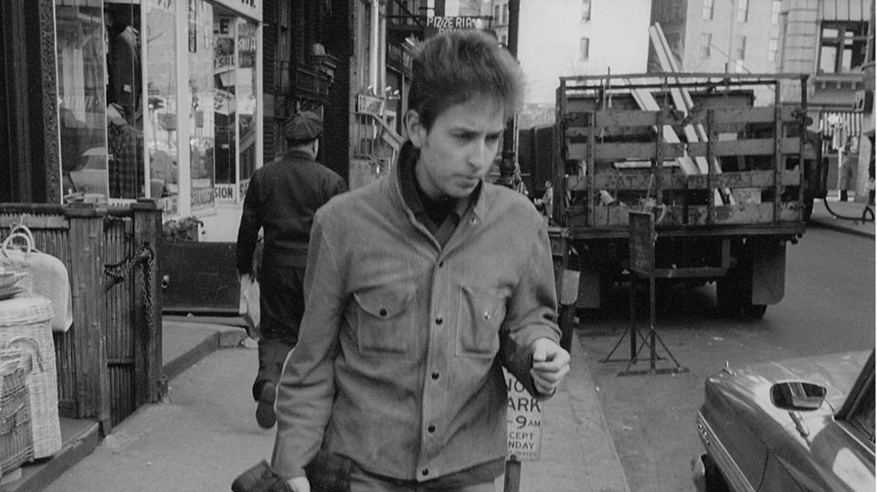 Dylan looks for a taxi after a magazine interview and photo session at his home on March 13th 1964. Photo Ted Rusell