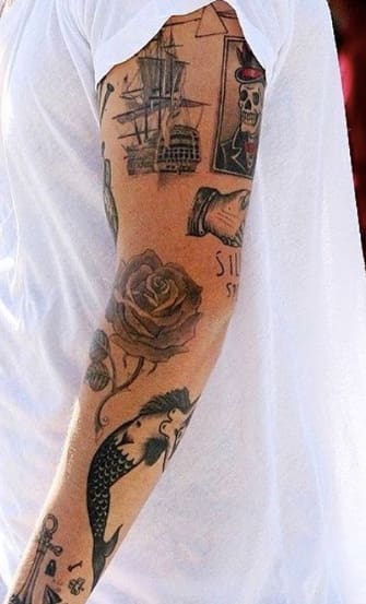 Harry Styles Ship Pink Floyd and Home Made Tattoos on His Arm  PopStarTats