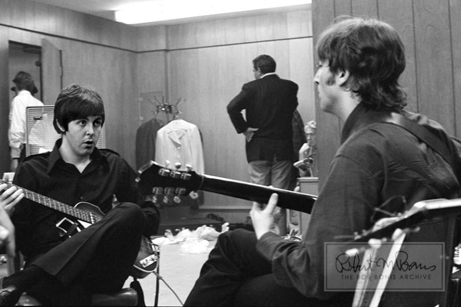 McCartney and Lennon prepare for a gig by jamming backstage in Detroit