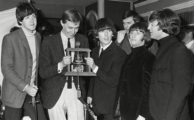 Dee (second from left) presenting the Radio Caroline first birthday 'bell' award for 'best and most consistent artistes' to the Beatles