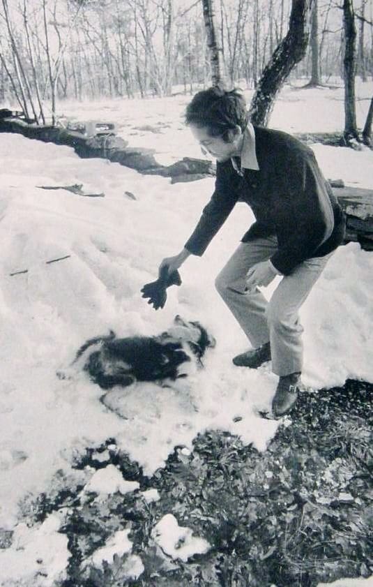 5- Bob Dylan playing with his dog in the snow