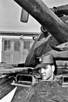 Elvis Presley in the drivers seat of a tank in Germany, 1958.