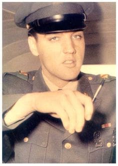 Elvis signing his name away