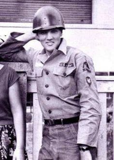 Taken at Elvis' off base home in Bad Neuheim, Germany, 1959. Elvis was getting ready to report to base for guard duty, which explains his odd non-combat helmet.