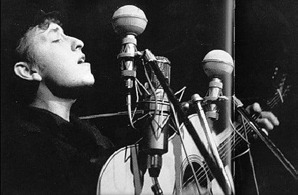 Bob Dylan performs at The Bitter End folk club in Greenwich Village in 1961. by Sig Goode