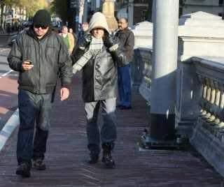 Dylan with his bodyguard on tour in Amsterdam on Thursday. (Photo: Polfoto/
