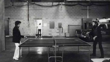 9 Bob Dylan Friend from the Band Levon helm playing ping pong. Barry Feinstein photograph