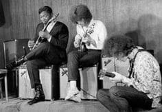 Sitting on a speaker B.B. King jammed on his guitar with Eric Clapton and Elvin Bishop in 1967 New York.