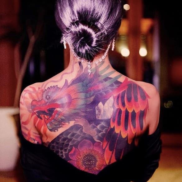 10 Jhene Aiko Tattoos and Meaning 4 Jhene Aiko colorful dragon tattoo on her back
