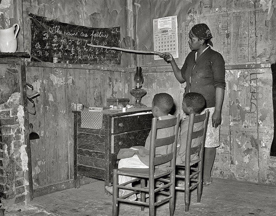 Mother home schools her children in Transylvania, Louisiana, 1937.