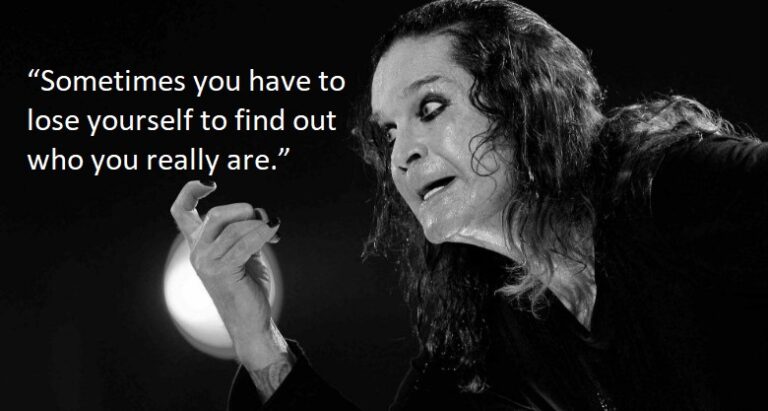 Ozzy Osbourne smiling, showcasing his lighter side and the humor behind his iconic quotes.
