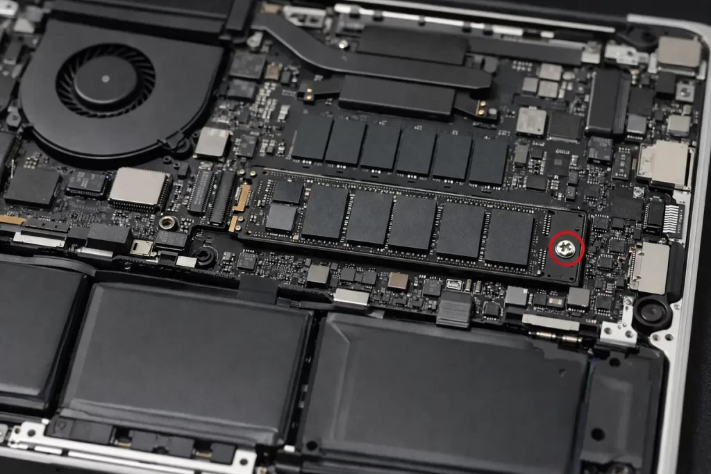 Can You Replace a MacBook SSD? Here's the Real Answer 3 Underside of a MacBook Pro with the bottom case removed, showing the SSD module and its retaining screw